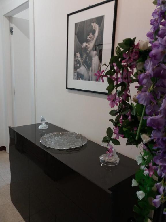 Hallway: the sideboard with flowers